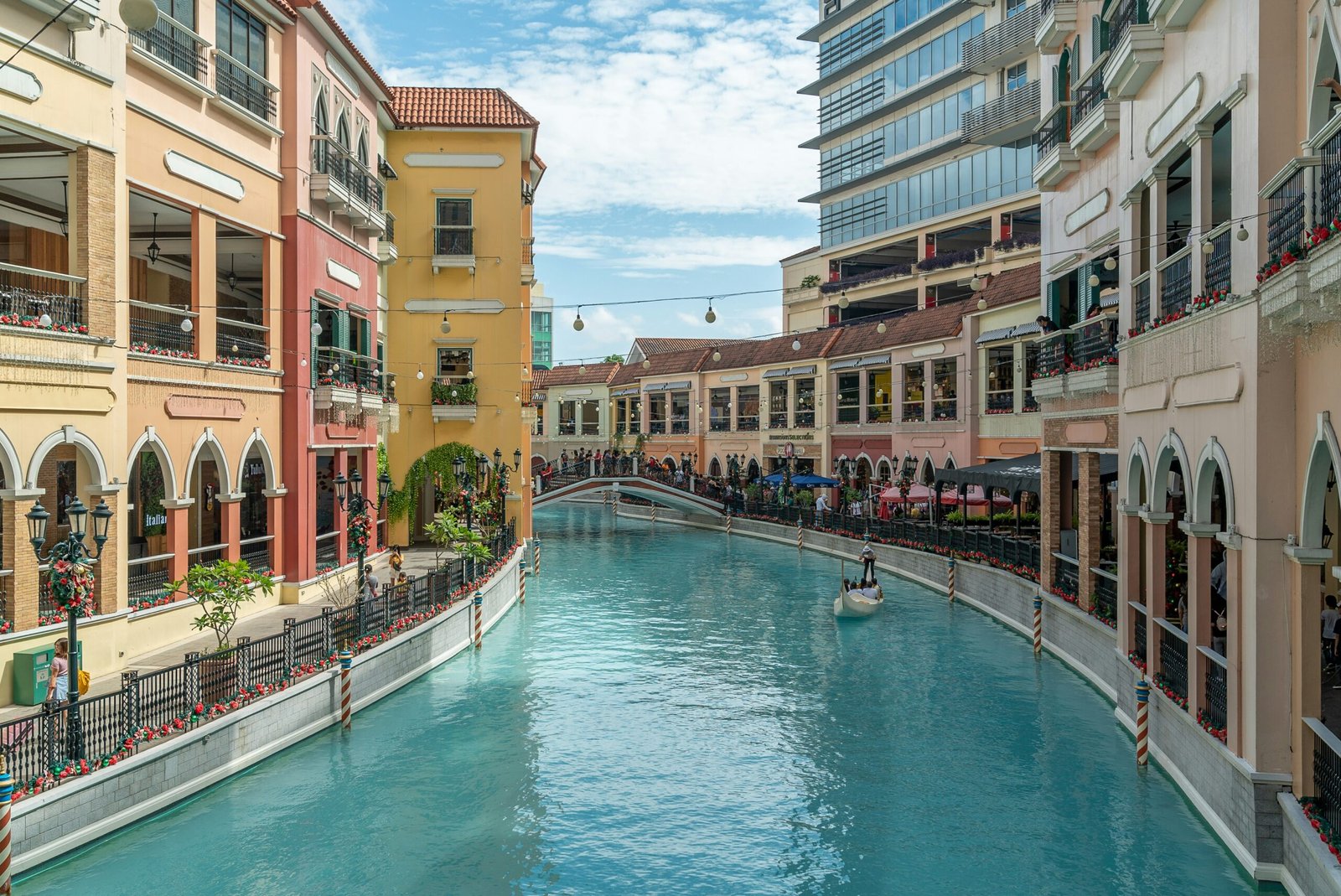 people in swimming pool near buildings during daytime