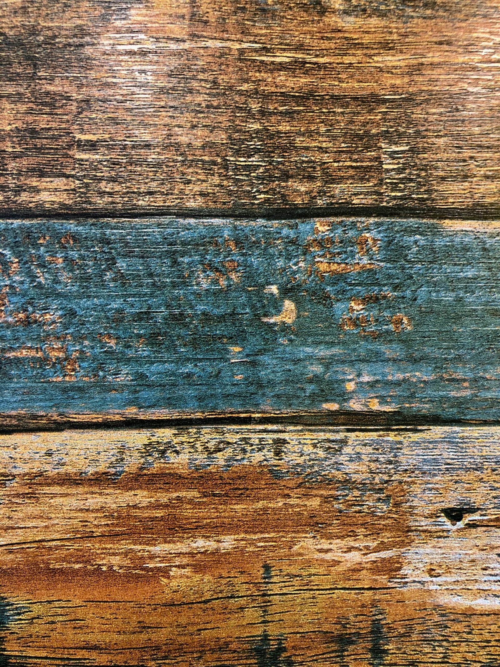 a close up of a wooden surface with peeling paint